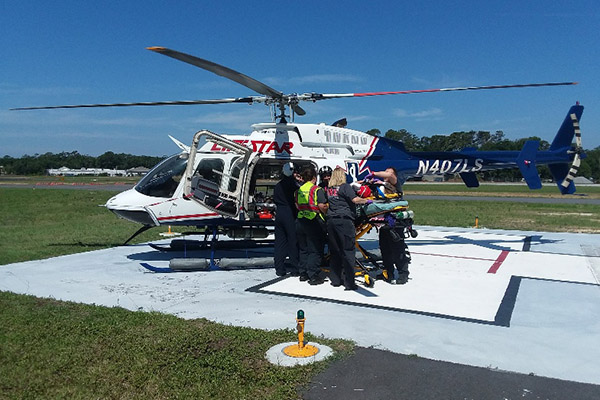 EMS loading patient onto LifeStar