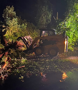 Clearing Debris with a Bobcat