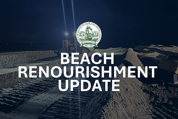 Bulldozer on Beach at night with Beach Renourishment Update text overlayed