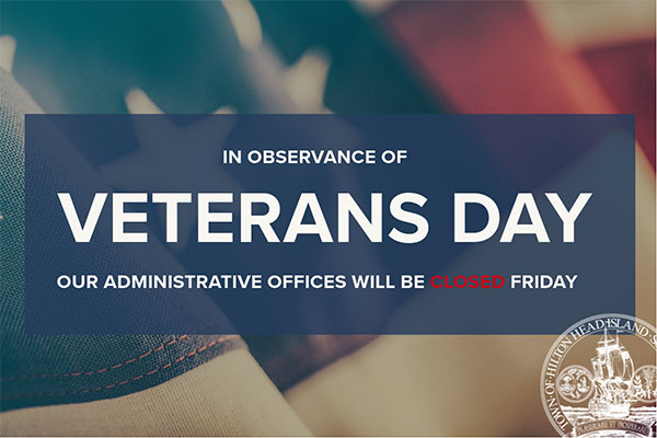 In Observance Veterans Day our administrative offices will be closed text over flag with town logo