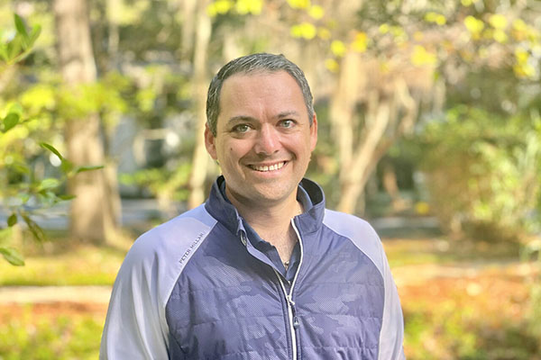 Kevin Tylus outside with trees in background